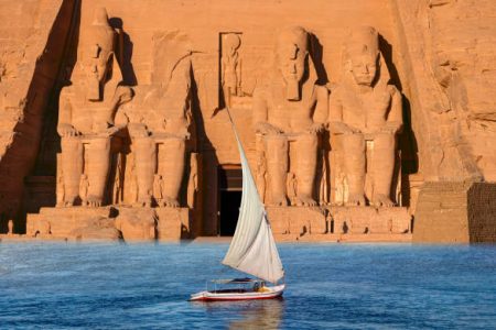 Traditional felucca sailing on the Nile River in Aswan Egypt