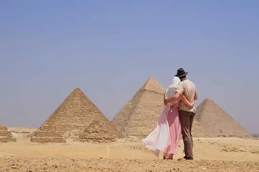 Tourists visiting the Great Pyramids of Giza in Cairo Egypt