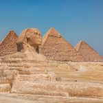 Tourists exploring the Great Pyramids of Giza in Cairo Egypt