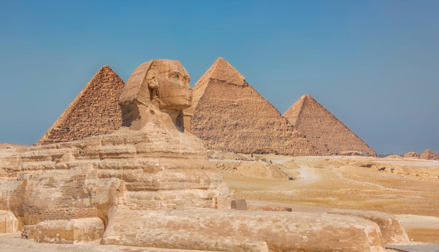 Tourists exploring the Great Pyramids of Giza in Cairo Egypt