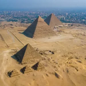 Tourists exploring the Great Pyramids of Giza in Cairo Egypt during autumn